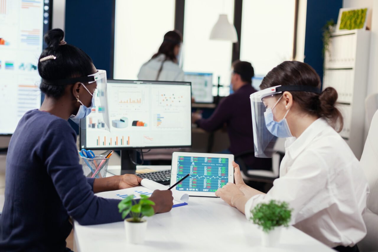 Financial team of big corporation doing financial analysis