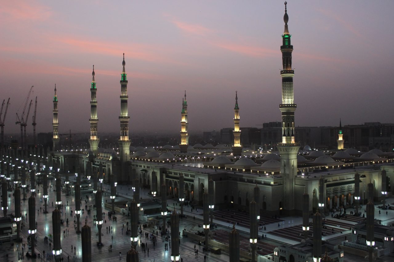 Moon between two towers of the Prophet's Mosque in Al Madinah, Saudi Arabia