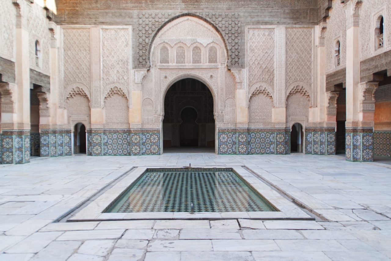 View of a courtyard of an islamic palace in Morocco, small pool in the centre, marble and amazing do