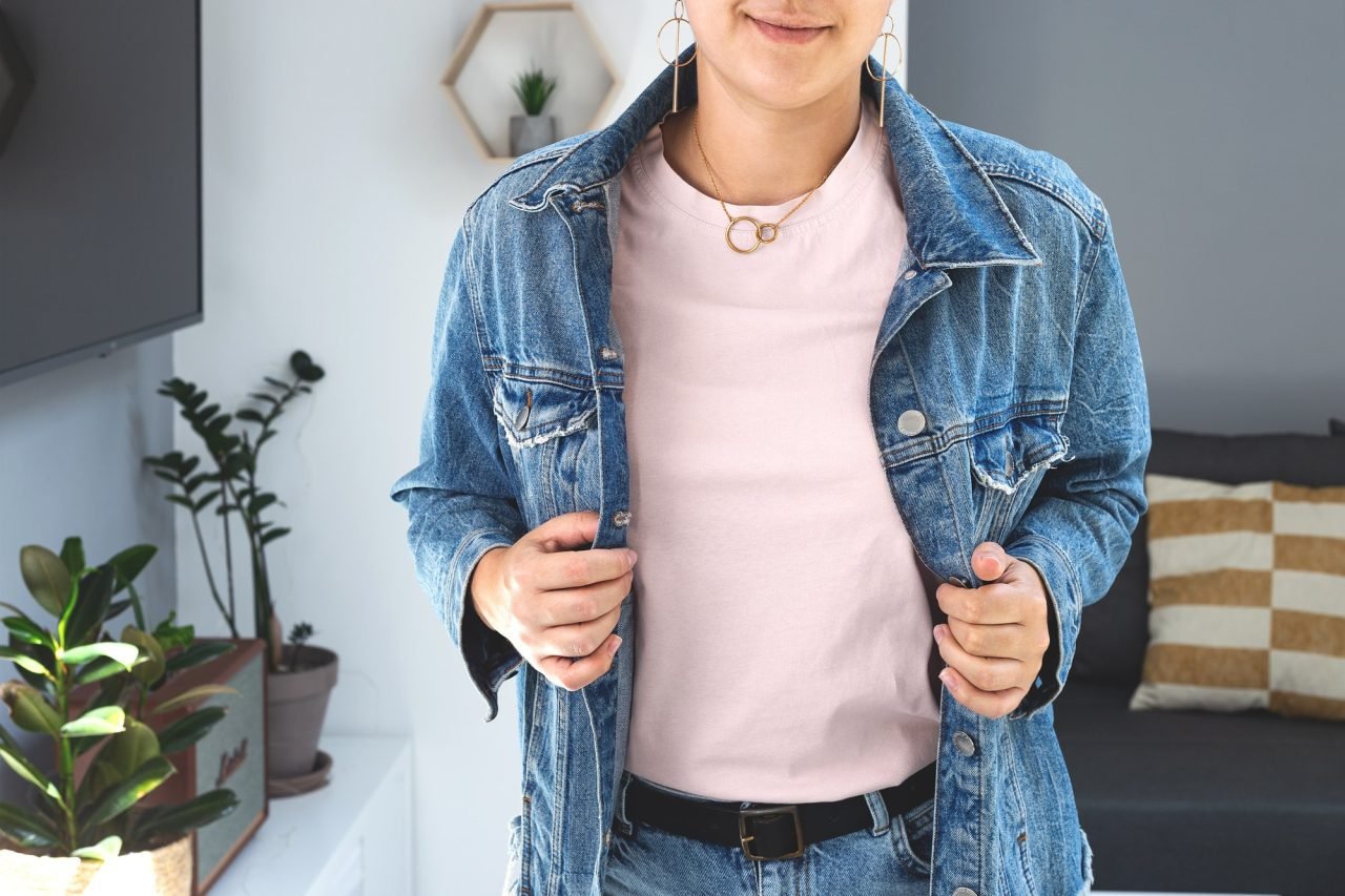 Woman wearing powdery color T-shirt Mock up under denim jacket. Bella Canvas Mockup.