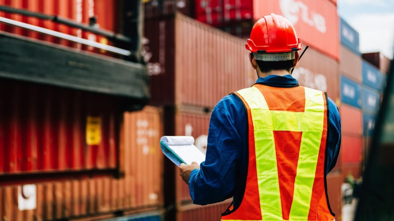 Warehouse engineer worker working at industrial container yard