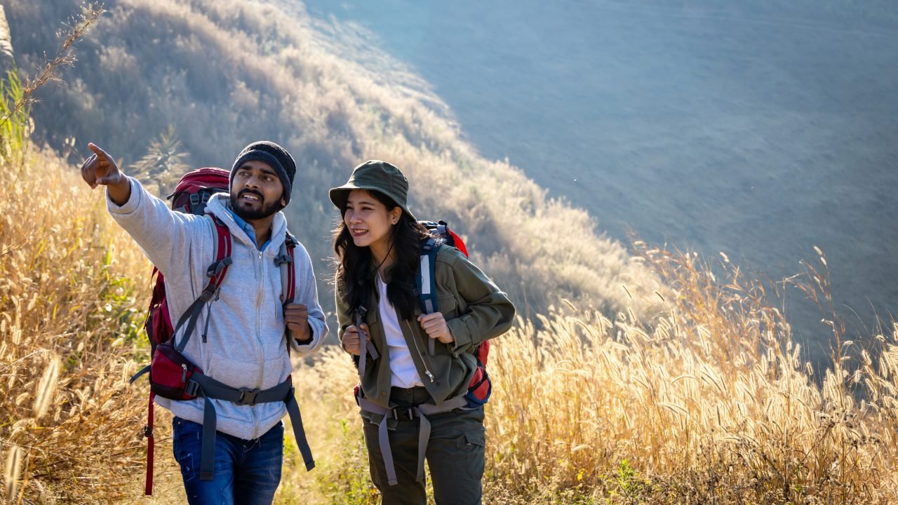 Travelers Hiking with Backpacks. Trail at Warm Sunny. Hikers with backpacks walks in mountains.