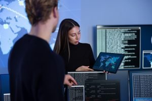 Cyber security team working in a Cyber Security Operations Center SOC to protect systems and