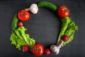 Fresh vegetables on a dark background. The concept of healthy nutrition and diet