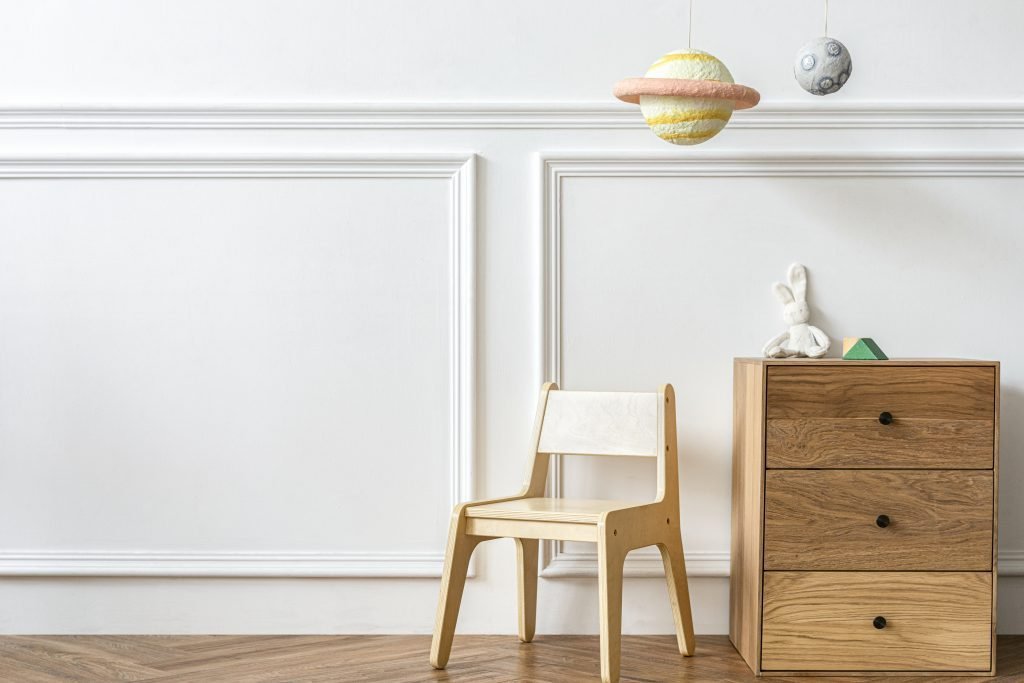Scandinavian kids play room with wooden furniture