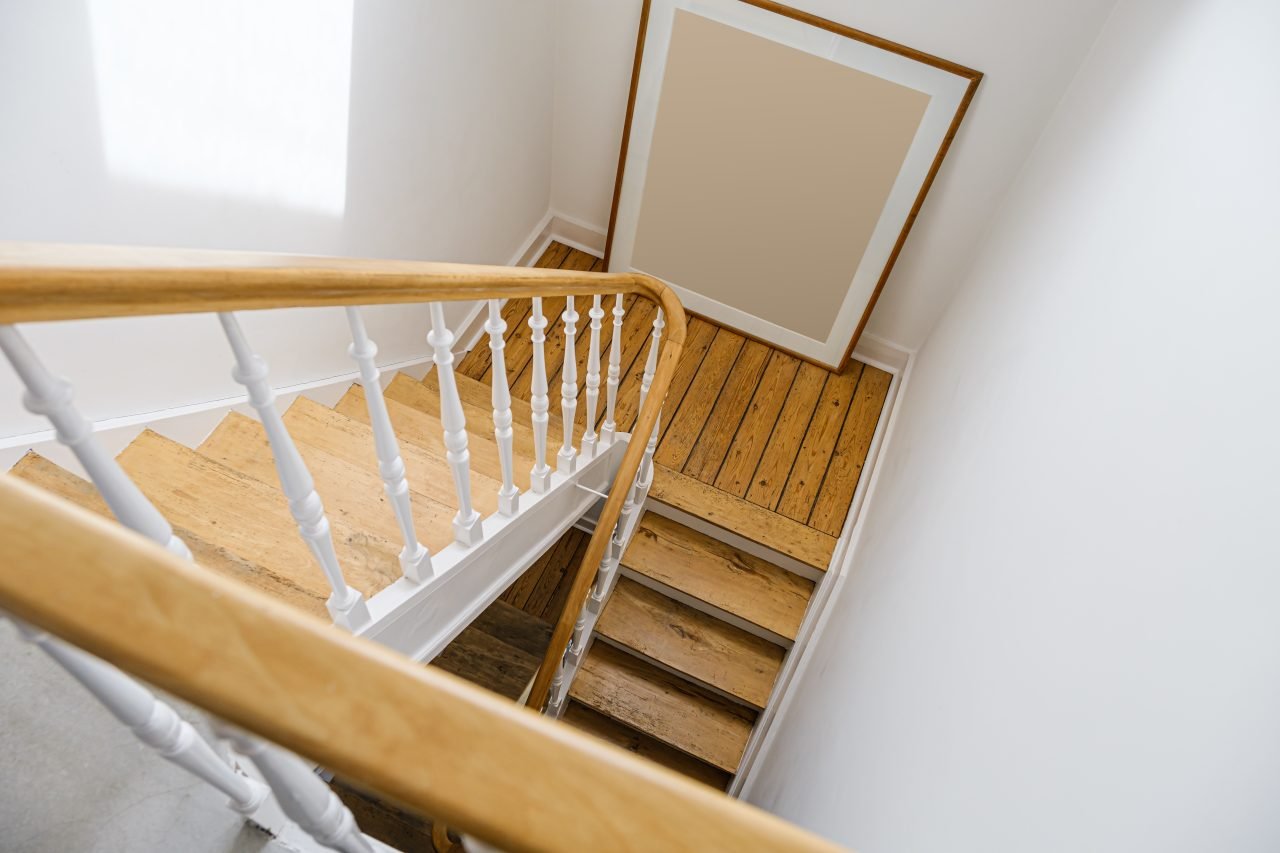 Wooden stairs and large empty frame