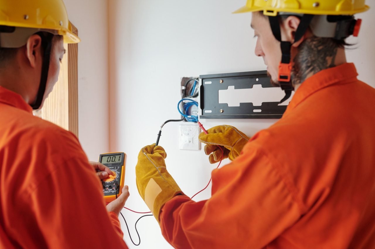 Electricians Testing Electrical Wires